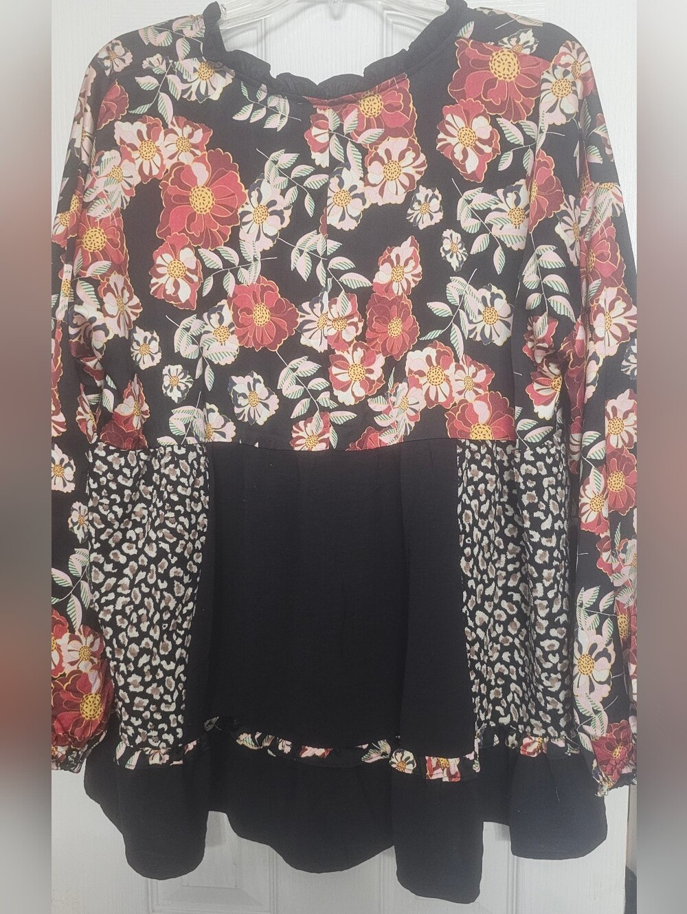 Umgee babydoll blouse features a bold, mixed design combining bohemian andanimal - Picture 5 of 10